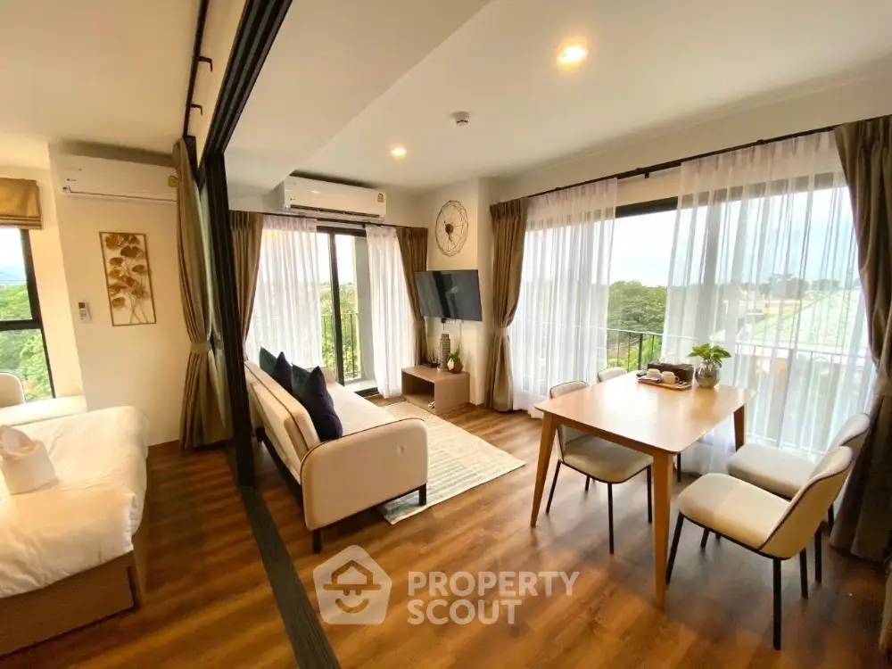 Spacious modern living room with large windows and scenic view