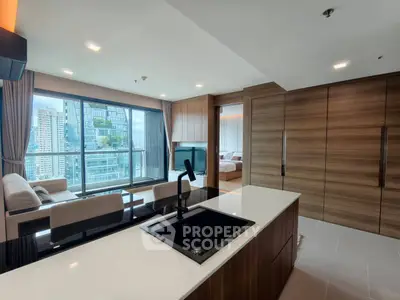 Luxurious open-plan living room with stunning city view and modern kitchen island