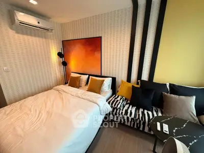 Modern bedroom with stylish decor and cozy bedding in a contemporary apartment.