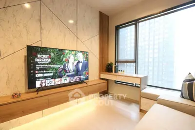Modern living room with large TV and stylish decor