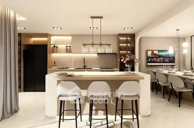 Luxurious modern kitchen with island and dining area, featuring elegant lighting and sleek design.