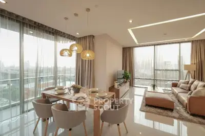 Luxurious modern living room with panoramic city views and elegant dining area.