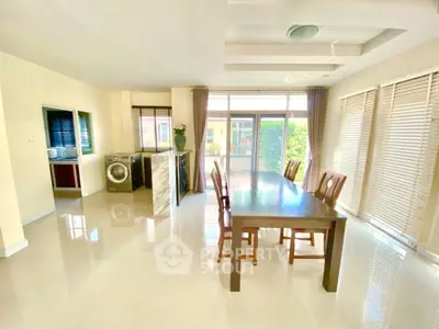 Spacious dining area with natural light and modern decor