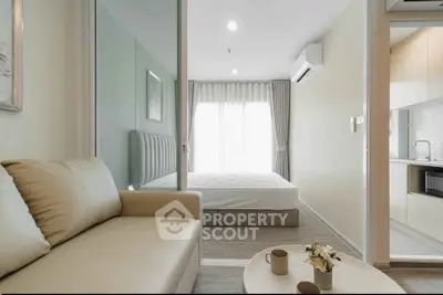 Modern apartment interior with cozy living room and elegant bedroom, featuring stylish furniture and natural light.