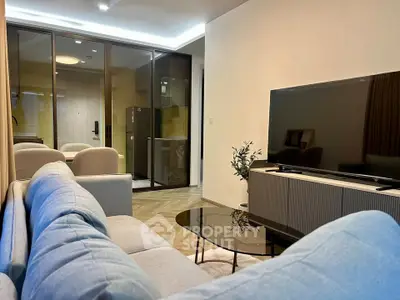 Modern living room with sleek furniture and open layout in a stylish apartment.
