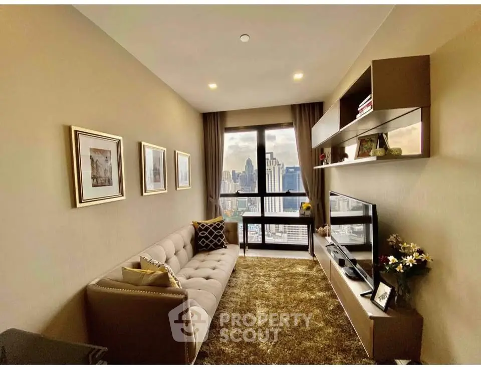 Stylish living room with city view, modern decor, and cozy seating area in high-rise apartment.