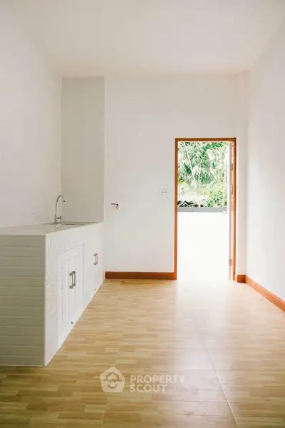 Minimalist kitchen with open layout and natural light