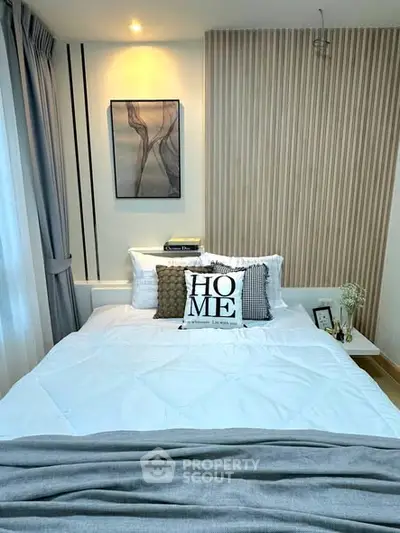 Cozy modern bedroom with stylish decor and soft lighting