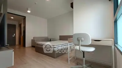 Modern bedroom with study area and large window in a stylish apartment