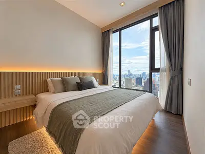 Luxurious bedroom with stunning city view and modern decor