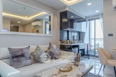 Luxurious modern living room with elegant decor and open kitchen layout, featuring a stunning view from the balcony.