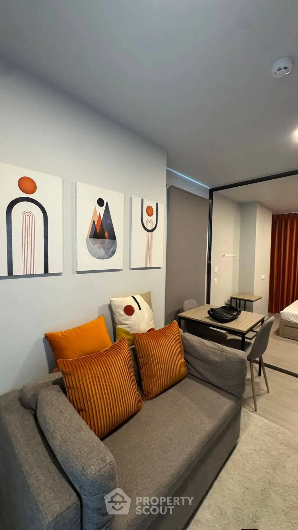 Modern living room with stylish decor and cozy seating in a contemporary apartment.