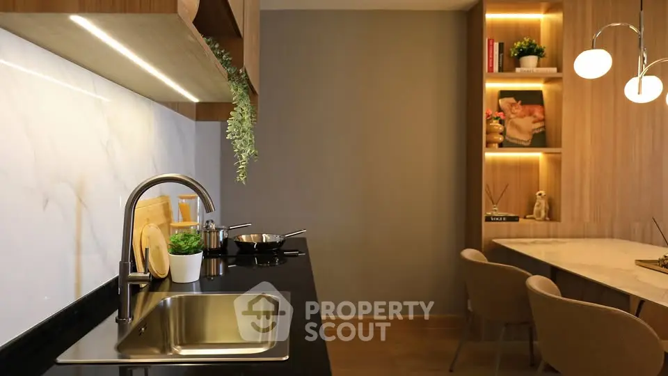 Modern kitchen with sleek design and elegant lighting