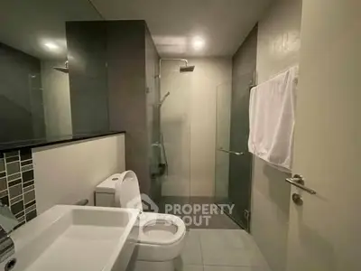 Modern bathroom with sleek design and glass shower enclosure