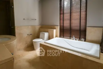 Luxurious bathroom with elegant bathtub and modern fixtures, perfect for relaxation and comfort.