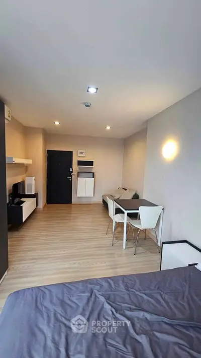 Modern studio apartment with open layout and stylish furnishings