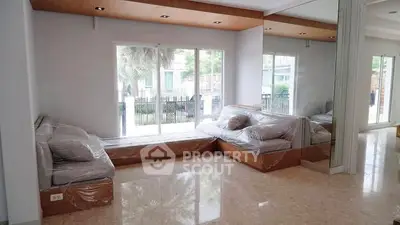 Spacious living room with large windows and modern design