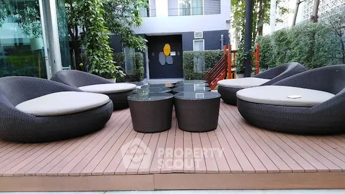 Stylish outdoor seating area with modern furniture and lush greenery