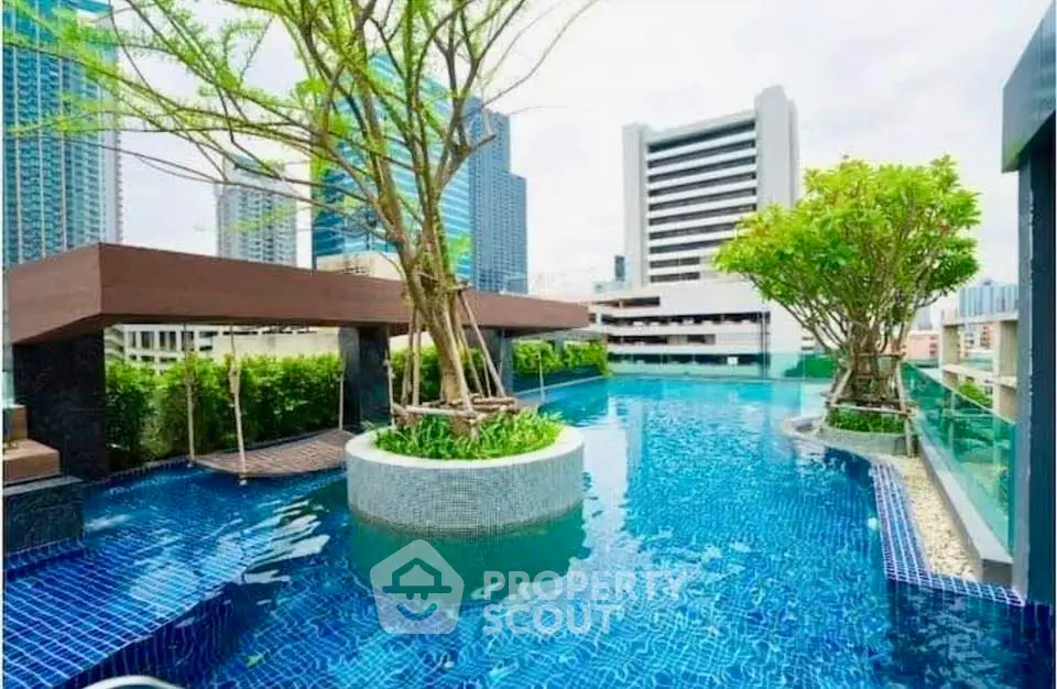 Luxurious rooftop pool with stunning city views and lush greenery in a modern urban setting.