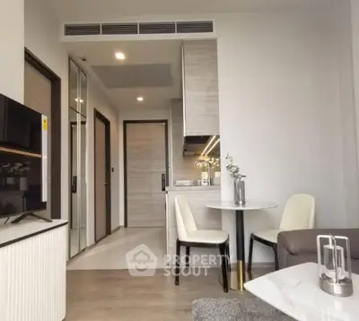 Modern open-plan living area with sleek kitchen and stylish decor