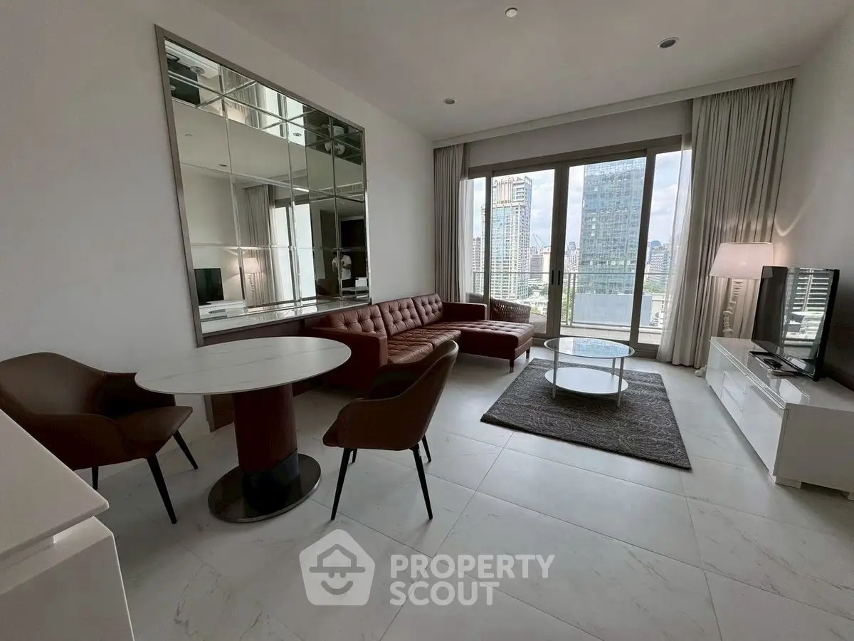 Modern living room with city view, featuring sleek furniture and large windows.