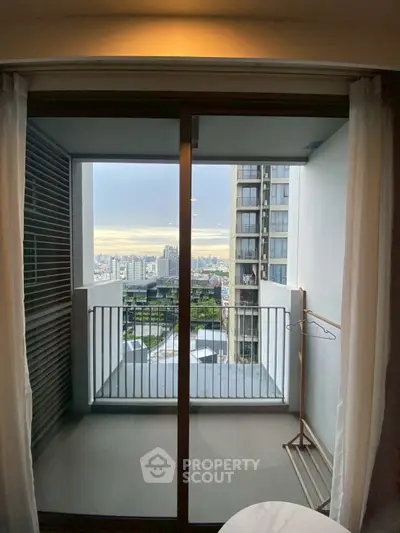 Spacious balcony with stunning city view in modern high-rise apartment