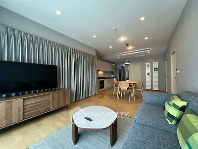 Spacious modern living room with open kitchen and stylish decor