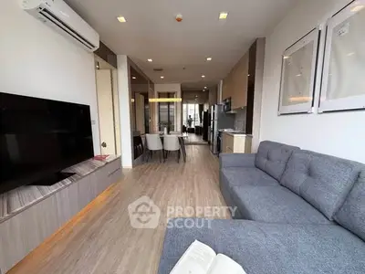 Spacious modern living room with stylish decor and open layout, perfect for relaxation and entertainment.