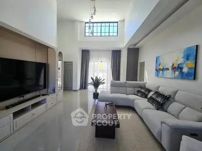 Spacious modern living room with high ceilings and elegant decor