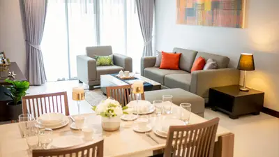 Stylish modern living room with elegant dining area and cozy seating, perfect for entertaining guests.