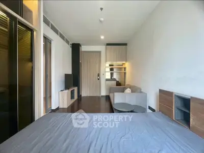 Modern studio apartment with sleek design and cozy living area, perfect for urban living.