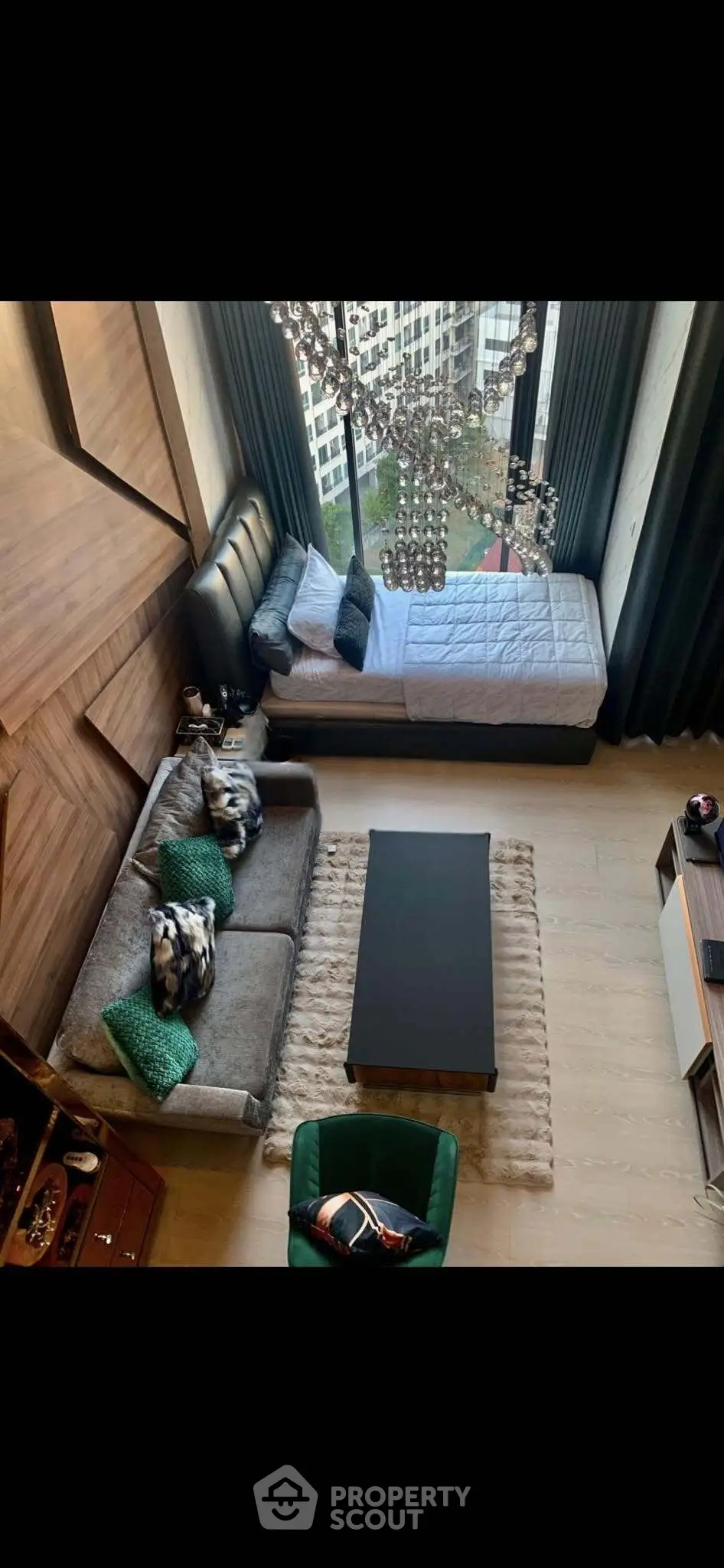 Modern living room with high ceiling and large window view