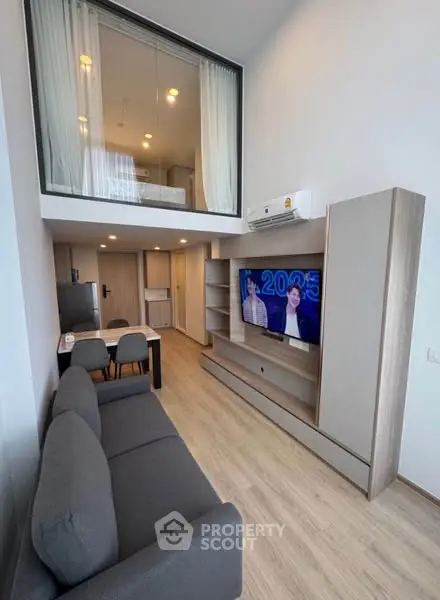 Modern duplex living room with sleek design and high ceiling