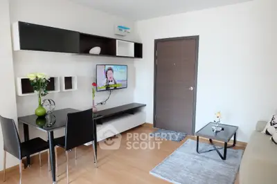 Modern living room with sleek furniture and wall-mounted TV