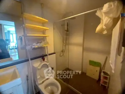 Compact bathroom with shower and toilet in modern apartment