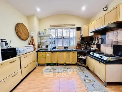Spacious kitchen with gas stove and ample storage in modern home