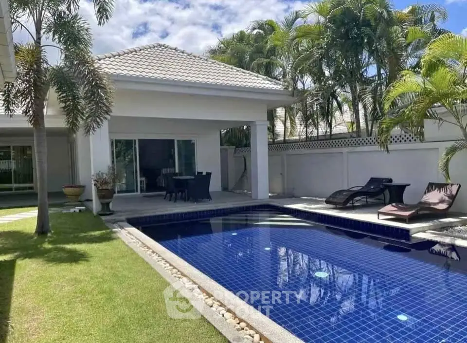Luxurious villa with private pool and lush garden, perfect for relaxation and entertaining.