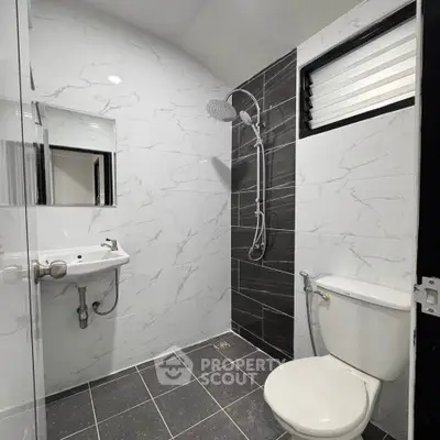 Modern bathroom with sleek shower and elegant tile design