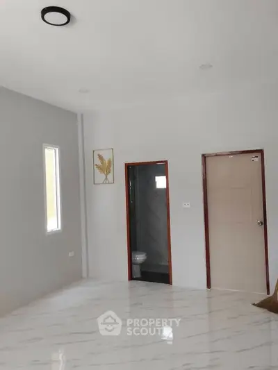 Spacious room with marble flooring and modern minimalist design