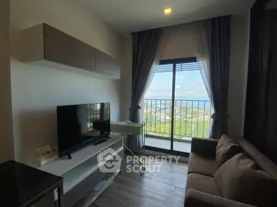 Modern living room with large window and scenic view, featuring a cozy sofa and sleek TV setup.