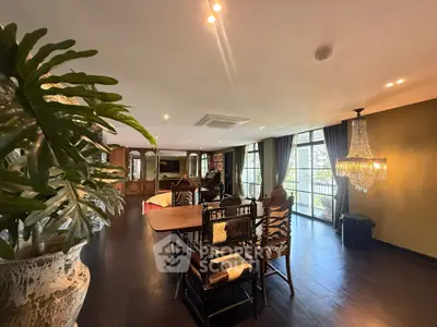 Luxurious living room with elegant decor and large windows offering natural light.