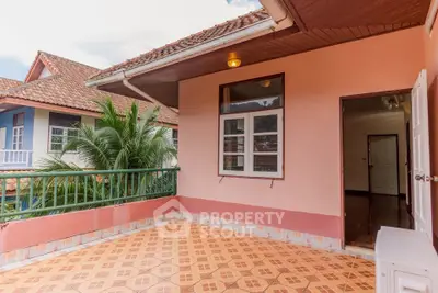 Charming balcony with tiled flooring and garden view in suburban home