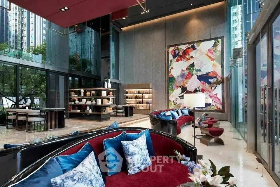 Luxurious modern living room with high ceilings and vibrant decor in upscale building.