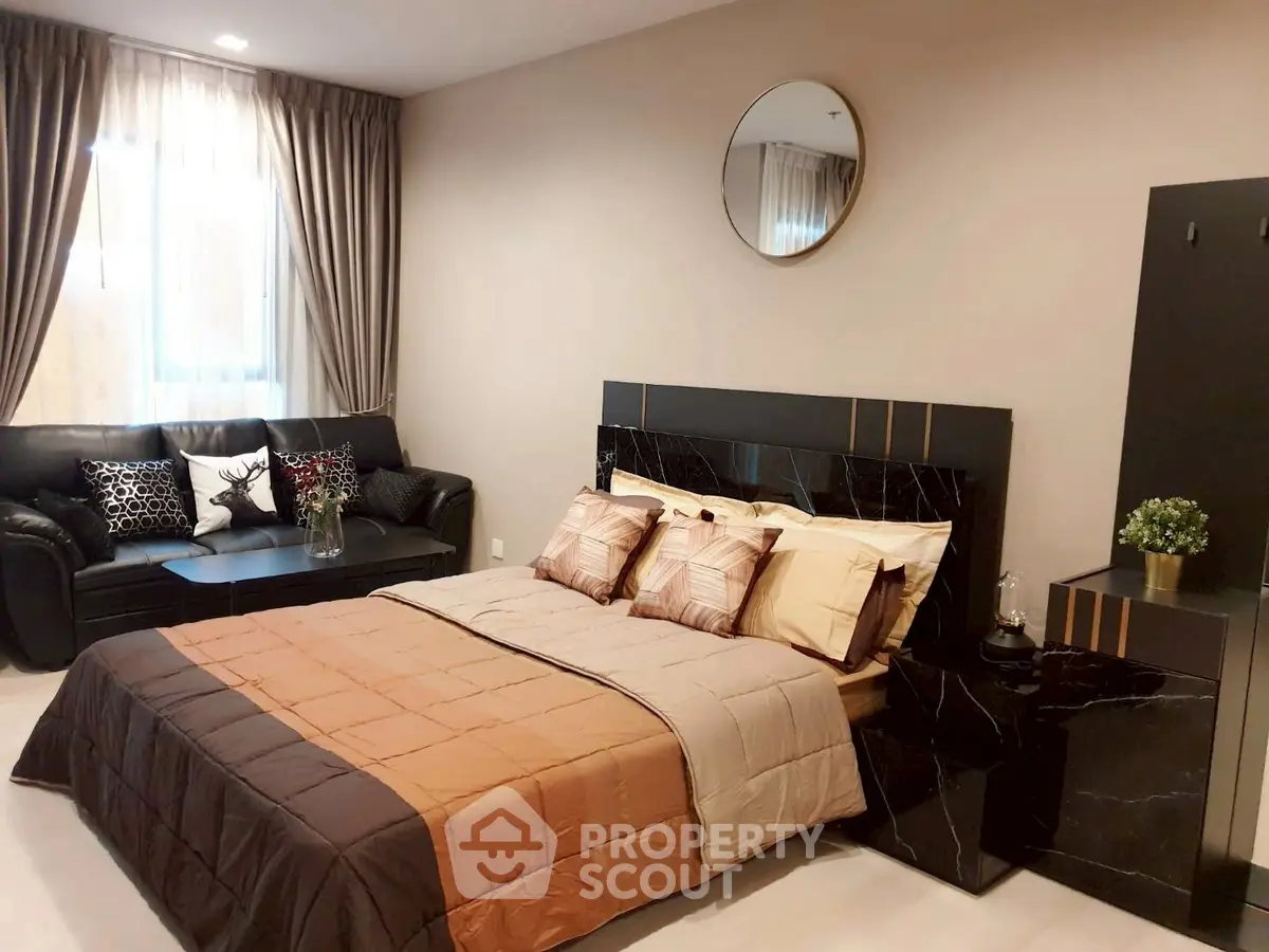 Luxurious bedroom with elegant decor and cozy seating area