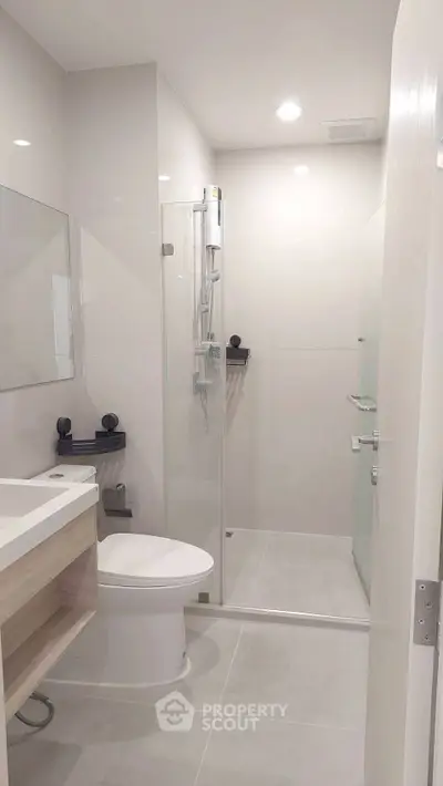 Modern bathroom with sleek design and glass shower enclosure