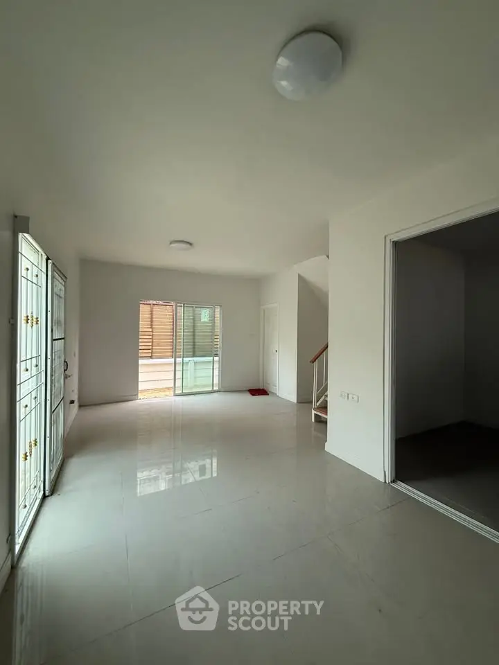 Spacious empty living room with large windows and modern design