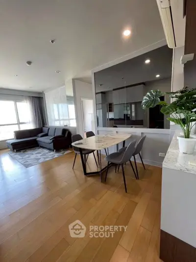 Modern living room with open layout and stylish dining area