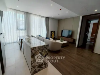 Spacious modern living room with elegant decor and large windows