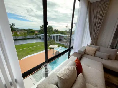 Luxurious living room with panoramic pool view and elegant decor