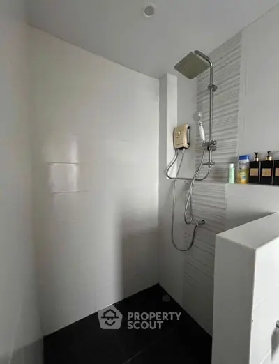 Modern bathroom with sleek shower fixtures and minimalist design